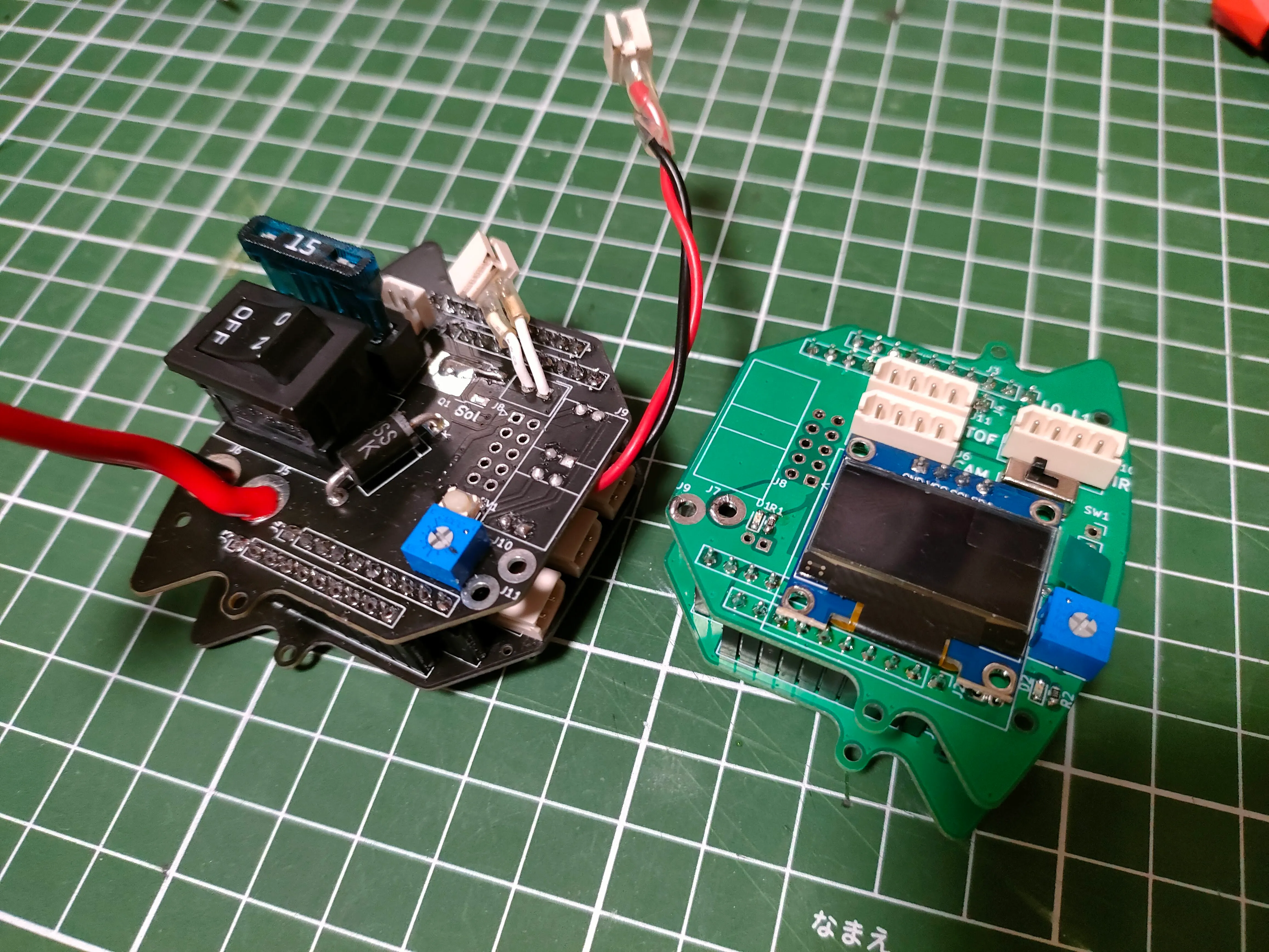 Two compact custom circuit boards for the Cranes soccer robot