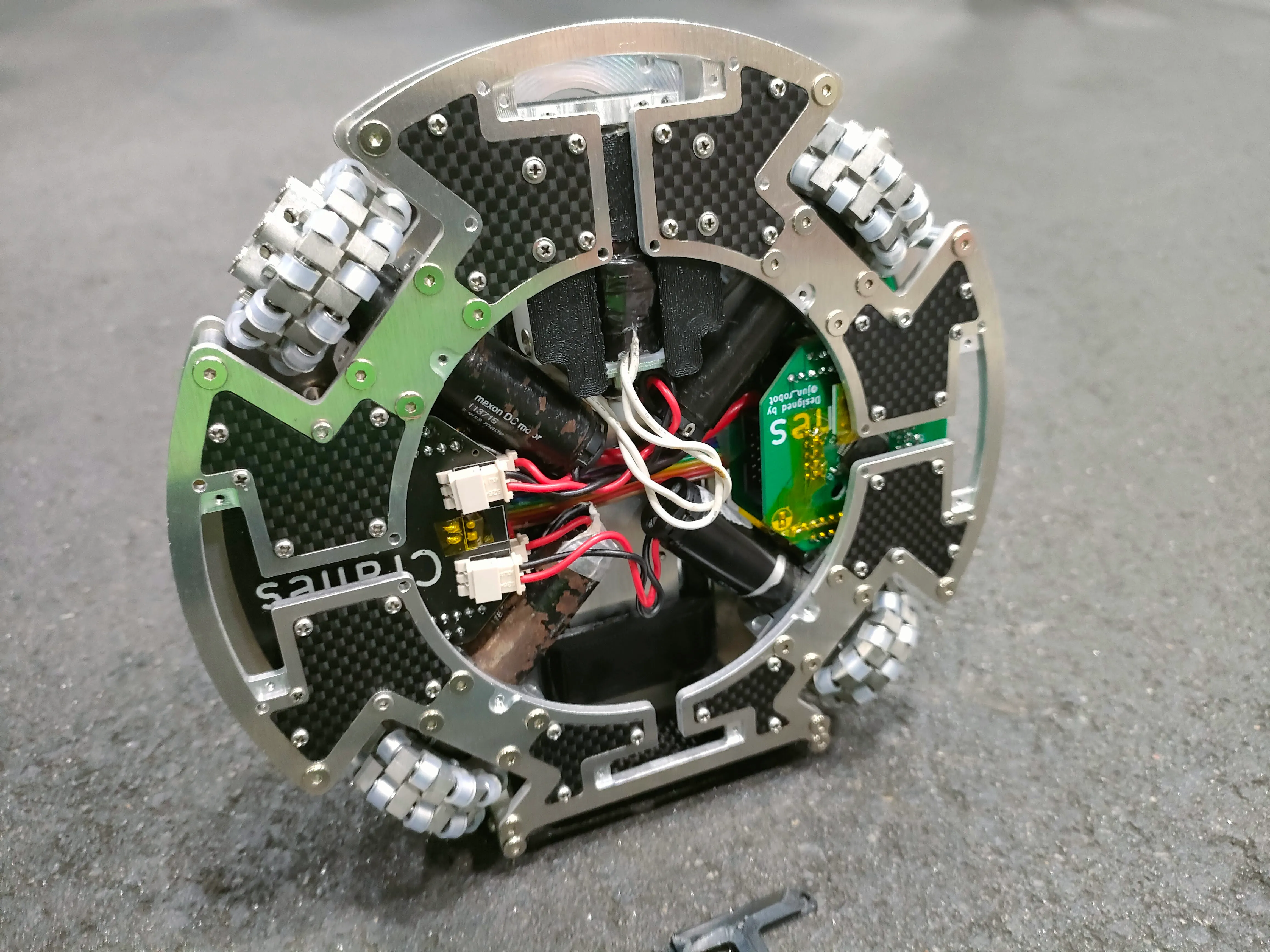 Top view of the Cranes soccer robot with electronics densely arranged inside its round chassis