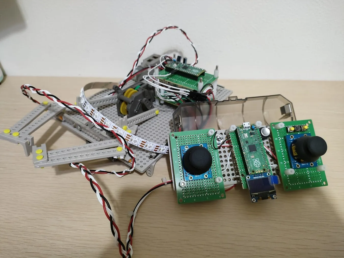 The ping-pong ball robot with its two wired controllers