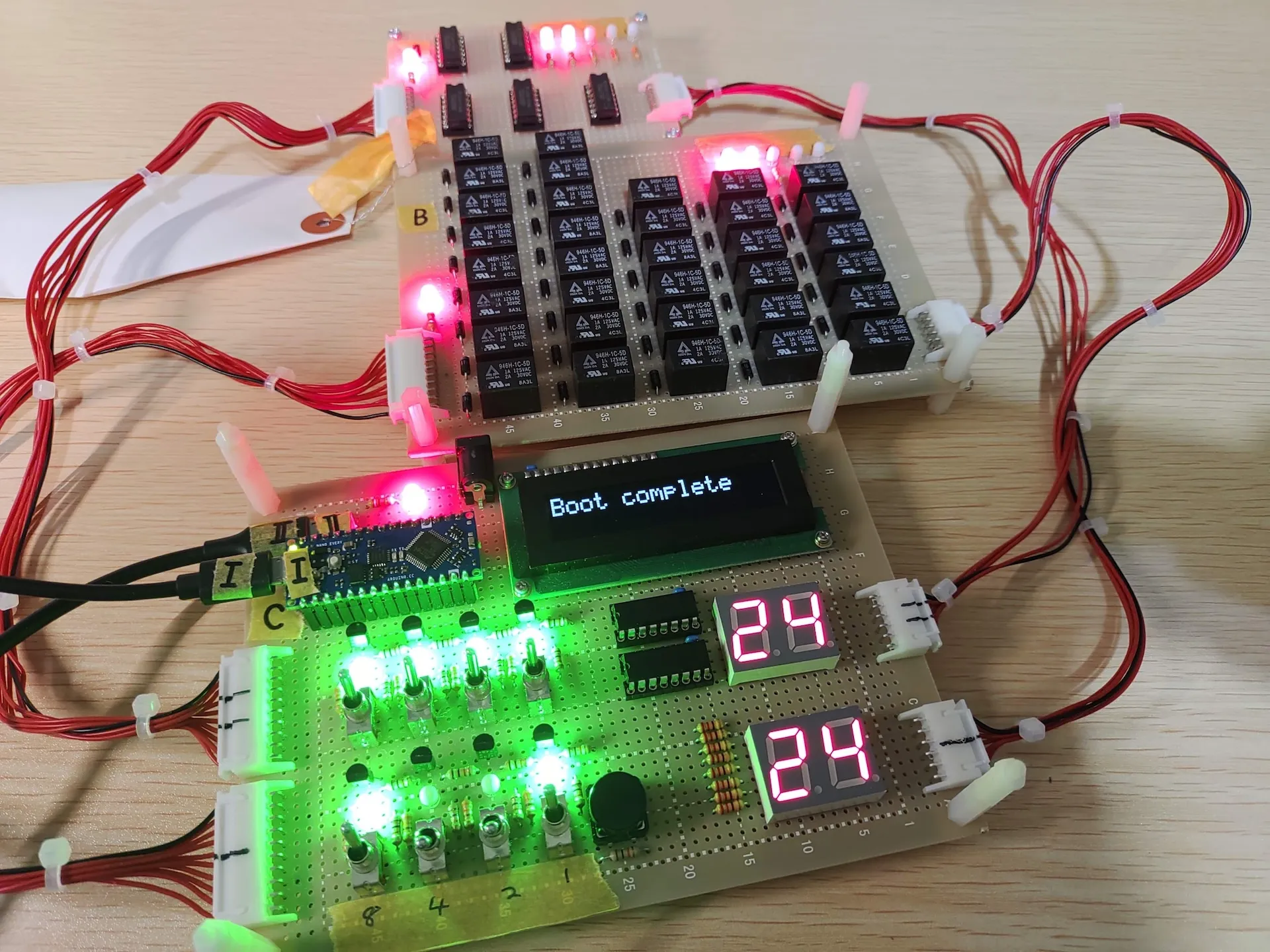 The illuminated circuit boards of the 4-bit relay adder